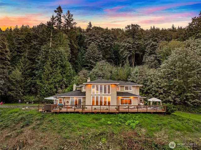a view of a house with backyard sitting area and garden