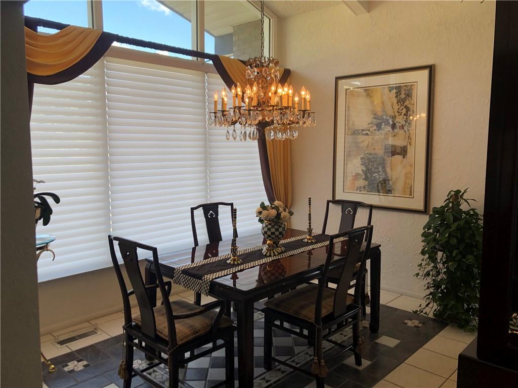 107 Spring Lane Uniontown, PA 15401 - Photo 19 of 50 a view of a dining room with furniture and a potted plant