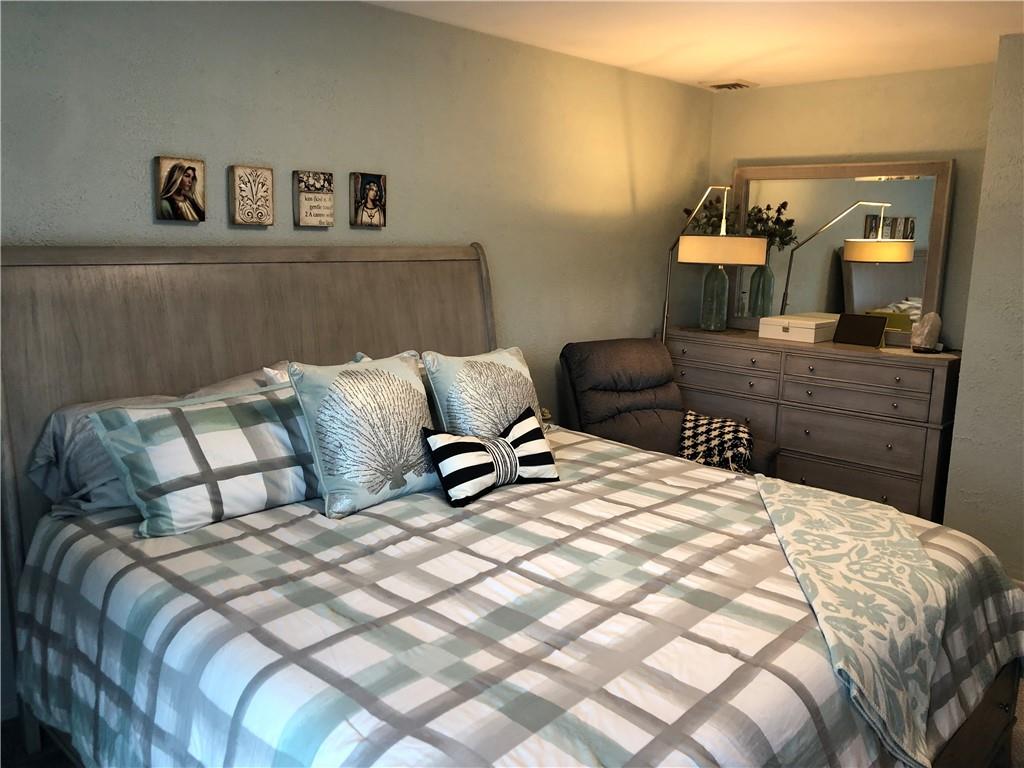 107 Spring Lane Uniontown, PA 15401 - Photo 23 of 50 a bedroom with a bed and a mirror