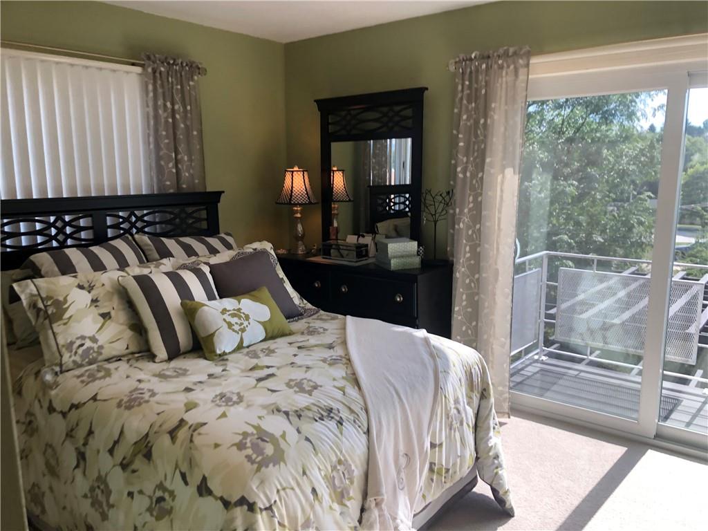 107 Spring Lane Uniontown, PA 15401 - Photo 25 of 50 a bedroom with a large bed and a large window