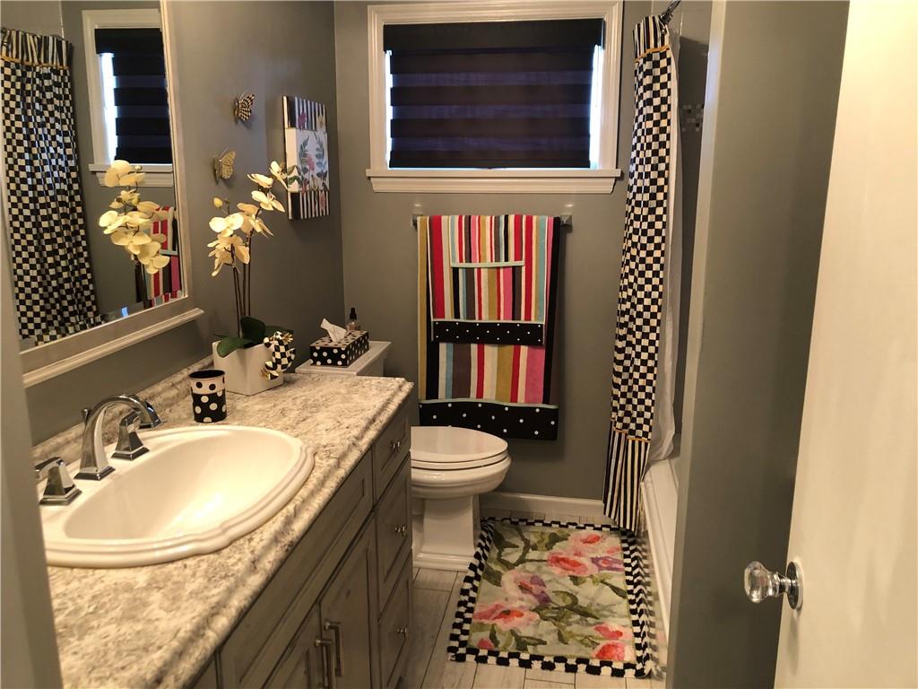 107 Spring Lane Uniontown, PA 15401 - Photo 26 of 50 a bathroom with a granite countertop sink toilet and a mirror