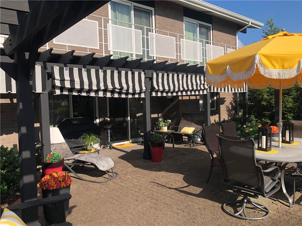 107 Spring Lane Uniontown, PA 15401 - Photo 40 of 50 a view of a patio with table and chairs and potted plants