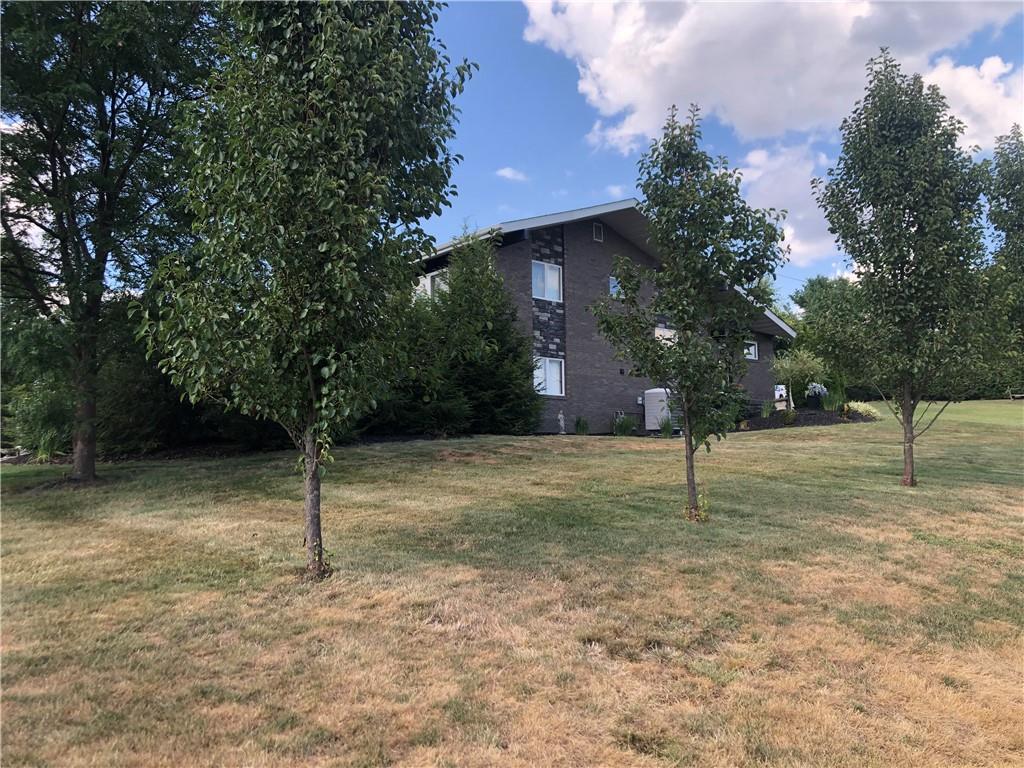 107 Spring Lane Uniontown, PA 15401 - Photo 47 of 50 a backyard of a house with lots of trees