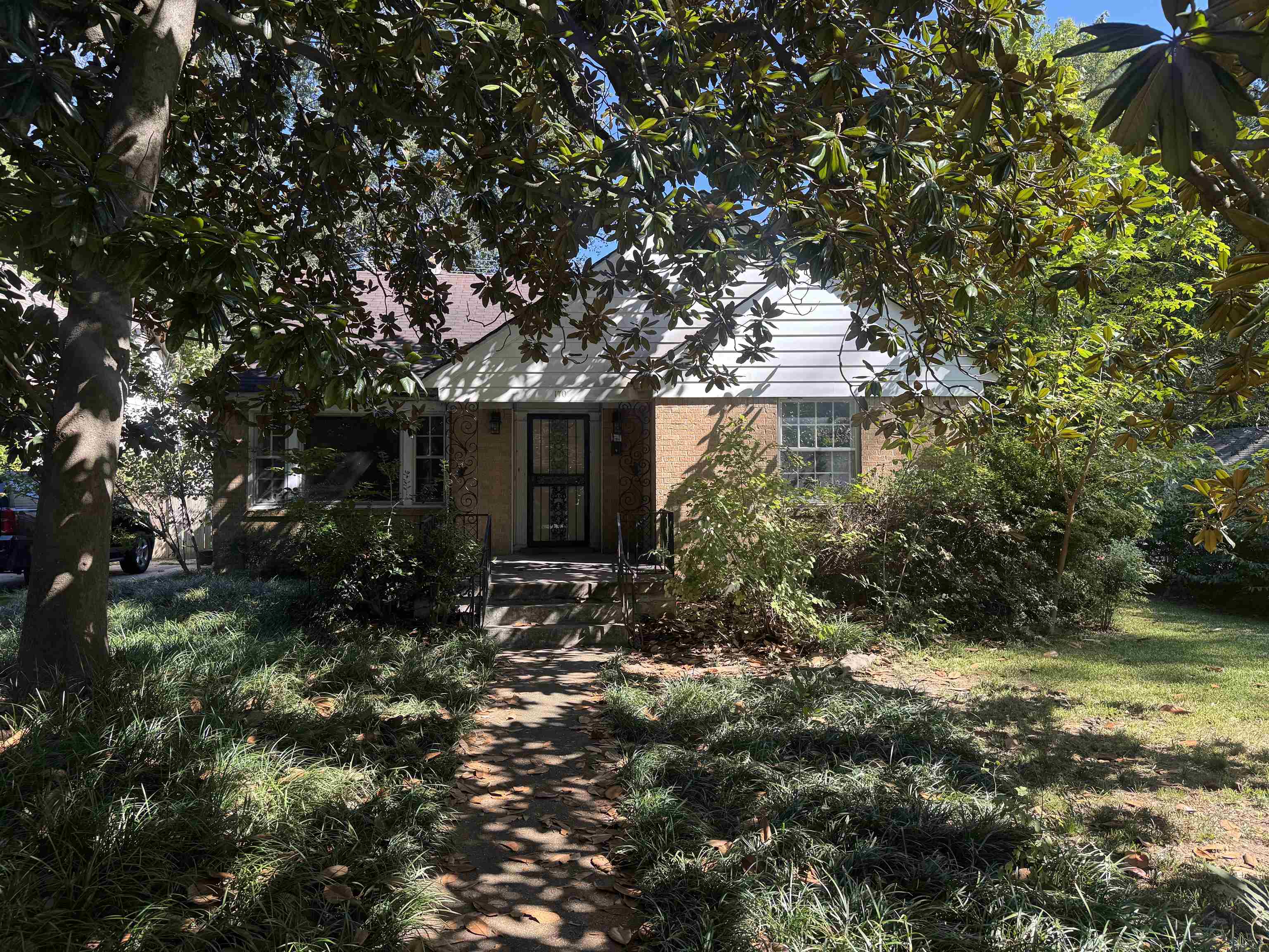 a view of a house with a tree