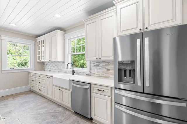 a kitchen with granite countertop a sink and a window