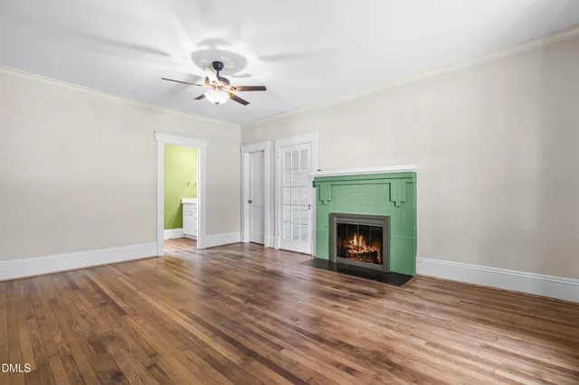 wooden floor in an empty room with a window