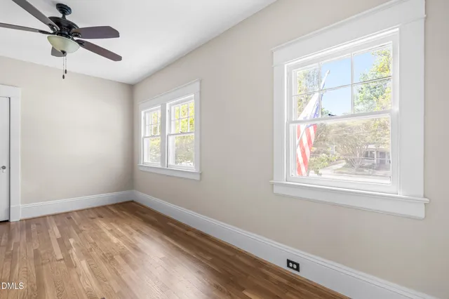 a bathroom with a granite countertop sink a toilet and bathtub