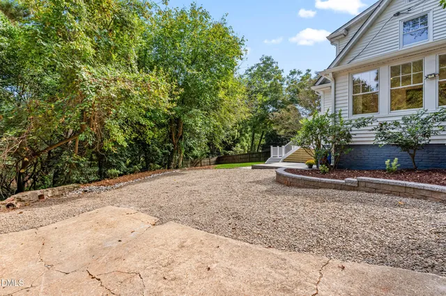 a view of a wooden door with a bench