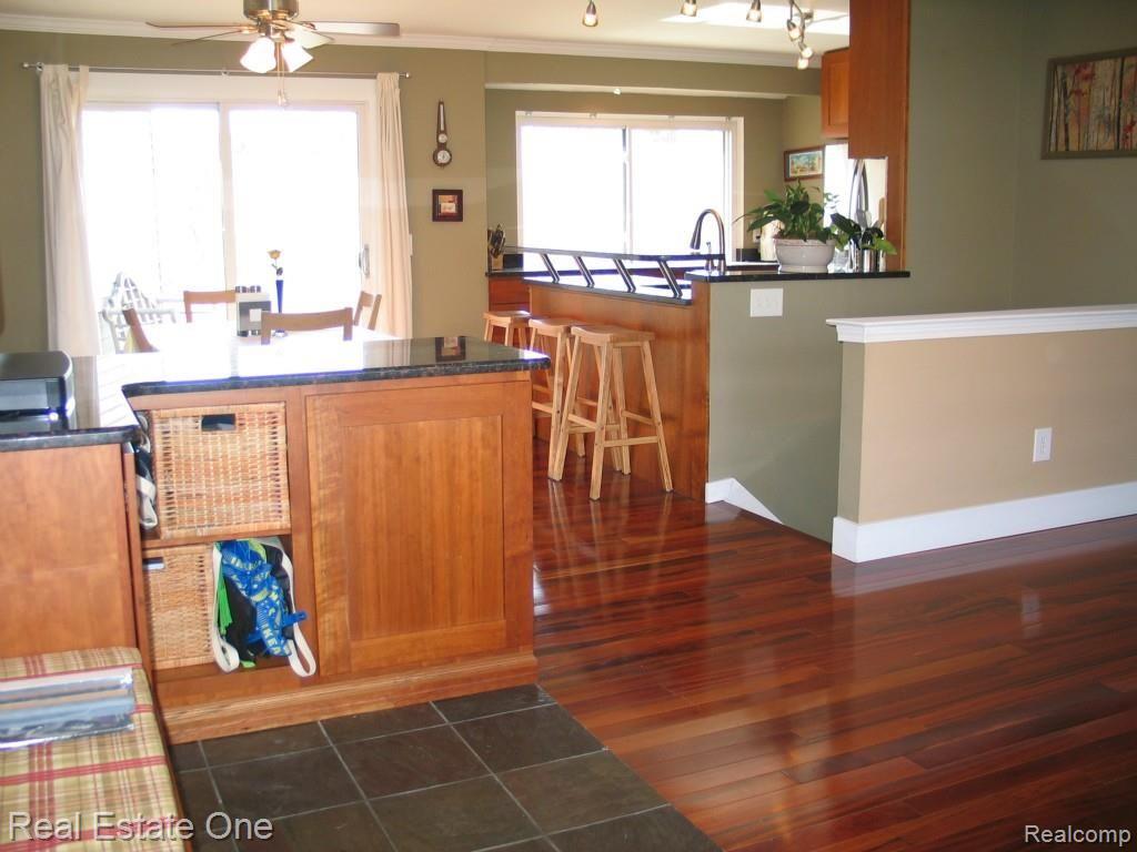 820 Brighton Lake Road Brighton, MI 48116 - Photo 10 of 42 Looking from front door into foyer, dining and kitchen