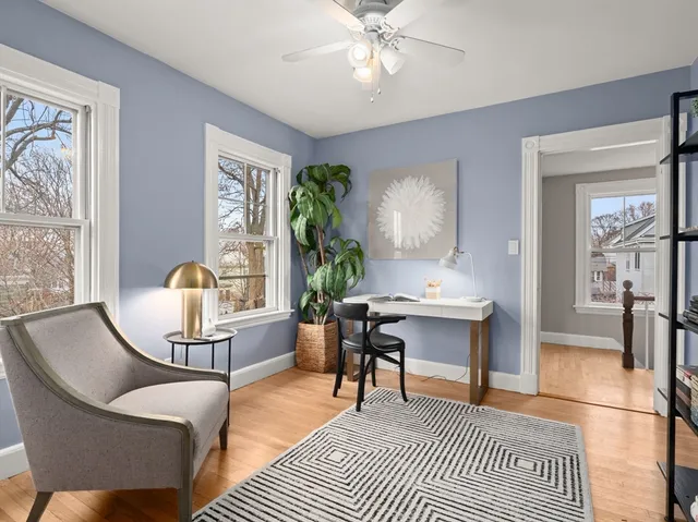 a view of a livingroom with furniture and a window