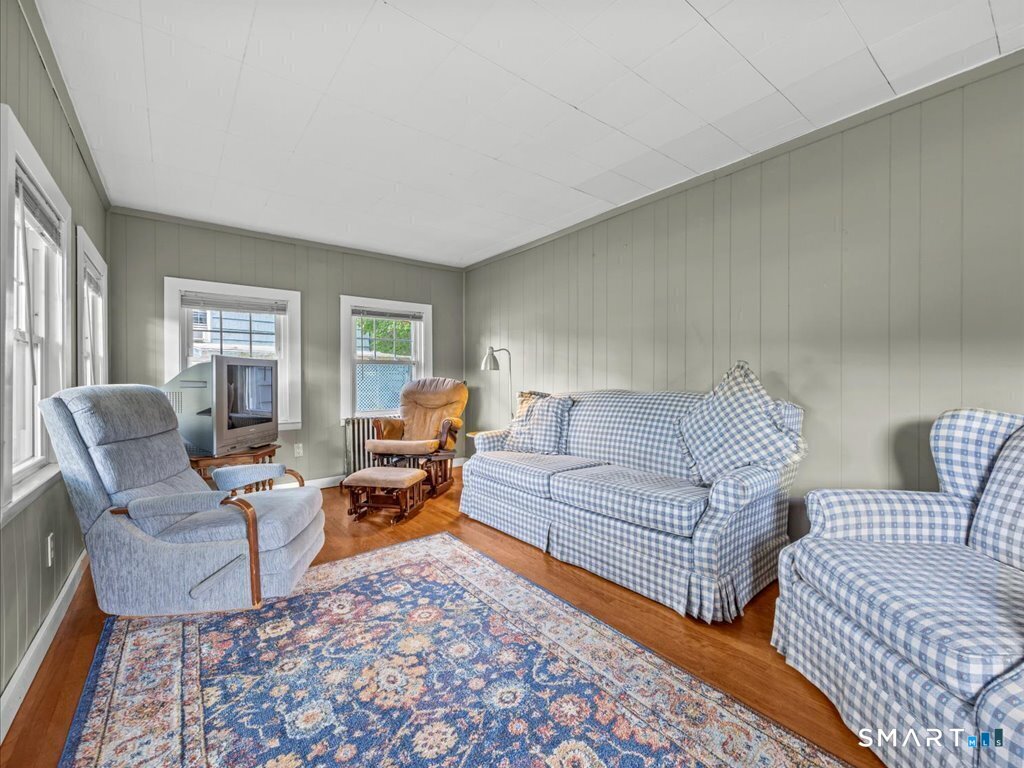 60 Pond Hill Road Wallingford, CT 06492 - Photo 7 of 36 COSY CHARMING LIVING ROOM W/ HARDWOOD FLOORS