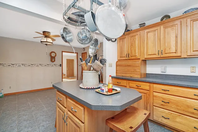 a kitchen with a sink cabinets and window