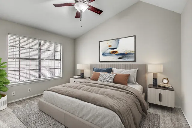 a bedroom with bed and a window