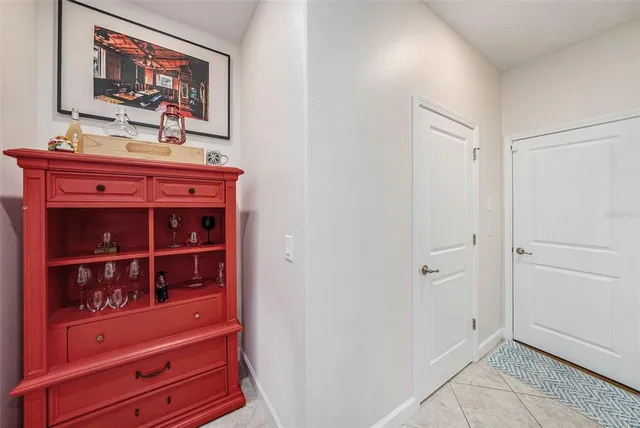 a view of a hallway with cabinet
