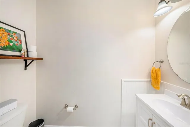 a bathroom with a sink and mirror