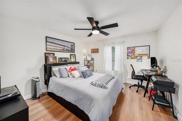 a bed room with a bed and a desk