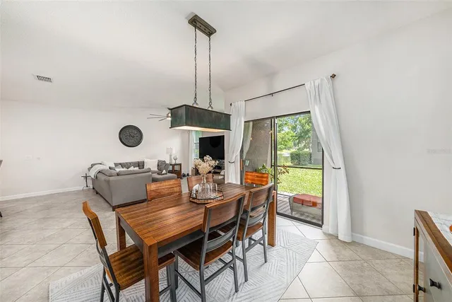a view of the dining room with furniture window and outside view