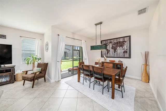 a view of a livingroom with furniture and a window