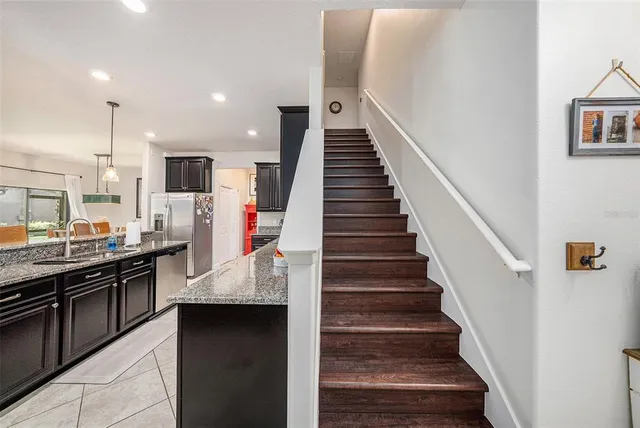 a view of kitchen with sink microwave and stove