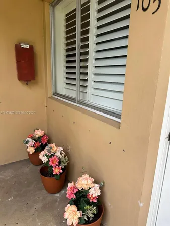 a bathroom with a sink a vanity and a window