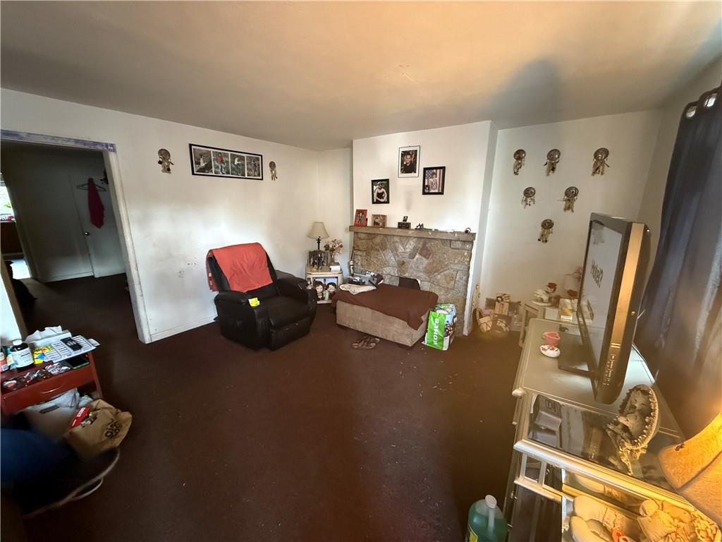 1205 Penn Street Pittsburgh, PA 15215 - Photo 17 of 49 a living room with furniture and a flat screen tv