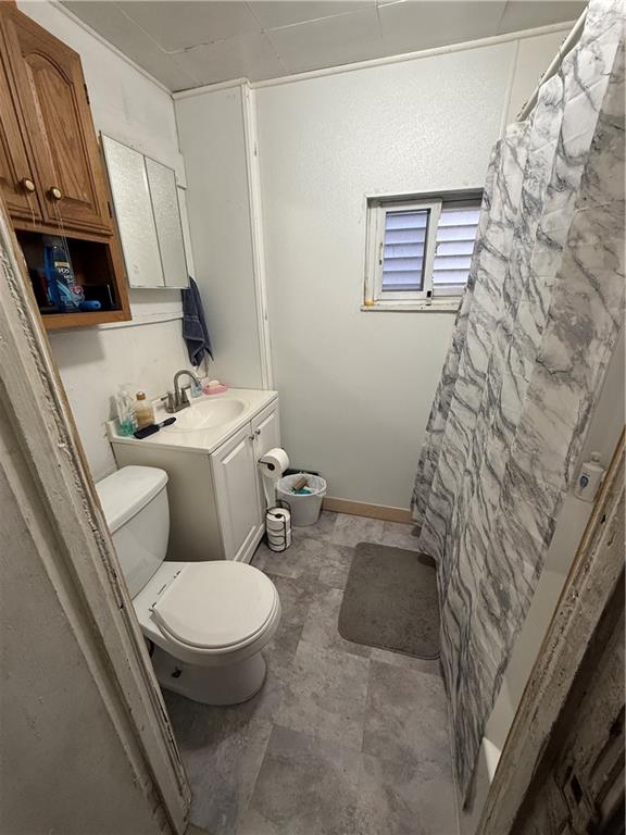 1205 Penn Street Pittsburgh, PA 15215 - Photo 20 of 49 a white toilet sitting next to a small bathroom