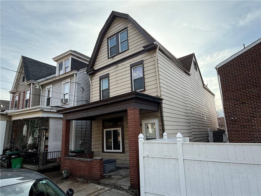 1205 Penn Street Pittsburgh, PA 15215 - Photo 2 of 49 a view of a house with large windows