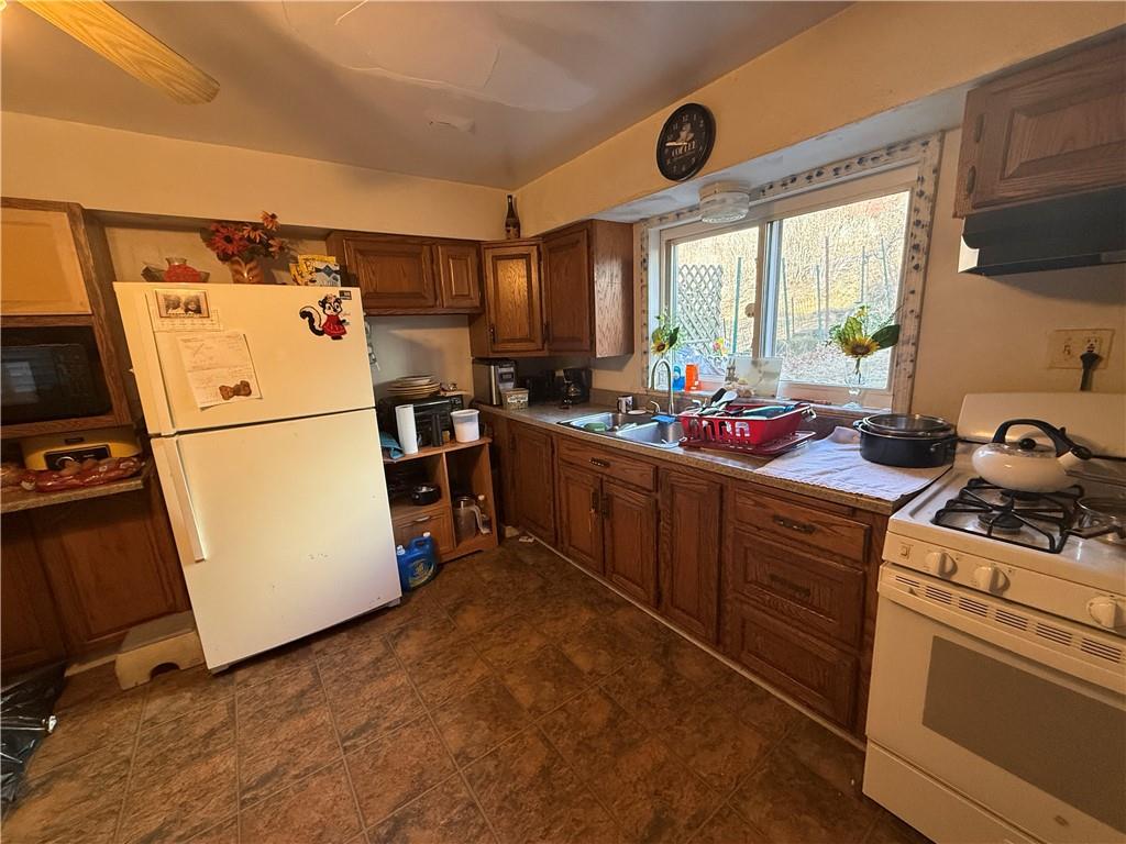 1205 Penn Street Pittsburgh, PA 15215 - Photo 21 of 49 a kitchen with a refrigerator and a sink