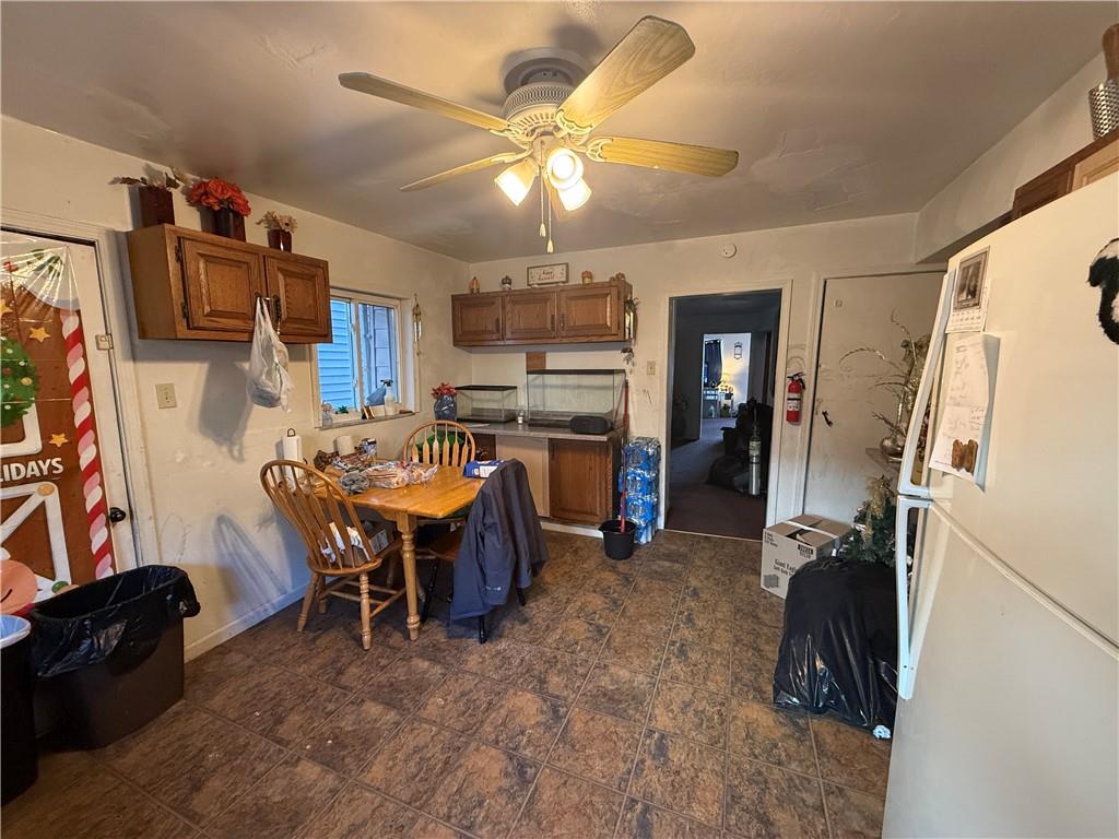 1205 Penn Street Pittsburgh, PA 15215 - Photo 22 of 49 a room with furniture a flat screen tv and a sink