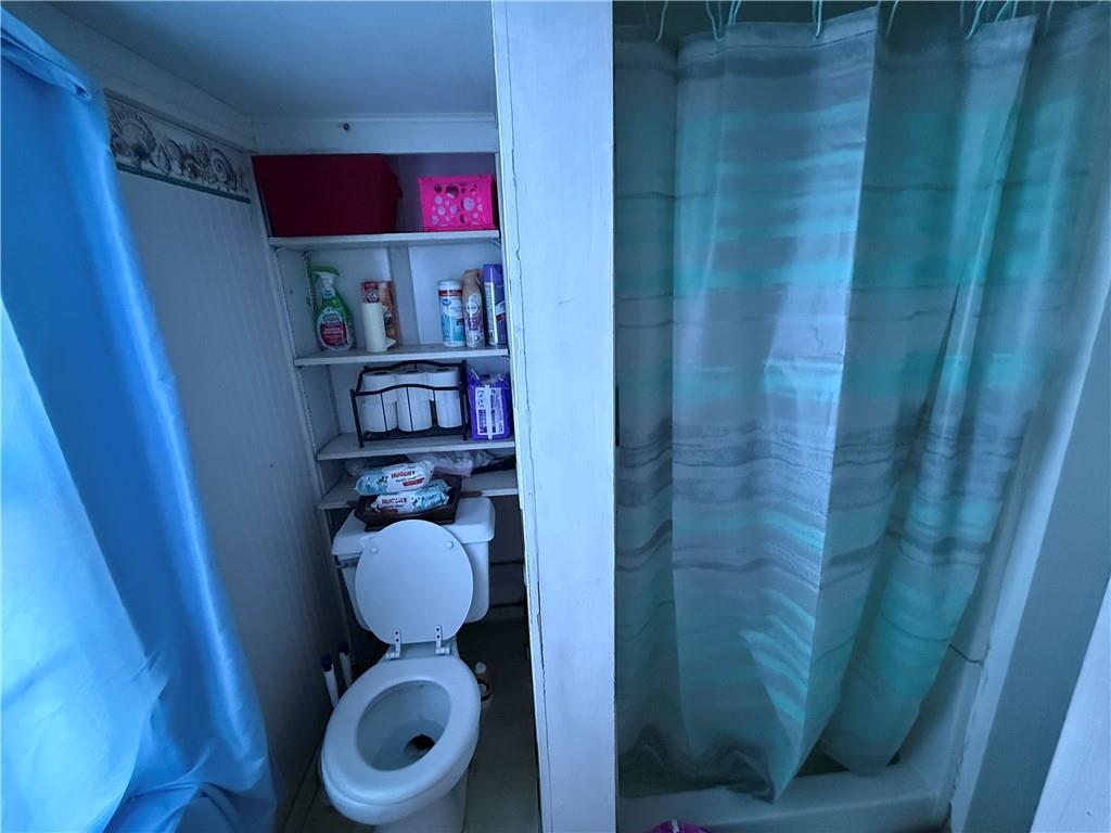 1205 Penn Street Pittsburgh, PA 15215 - Photo 23 of 49 a bathroom with a toilet and a shower