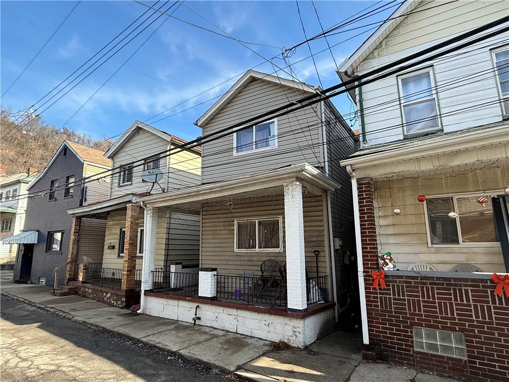 1205 Penn Street Pittsburgh, PA 15215 - Photo 25 of 49 a front view of a house with parking area