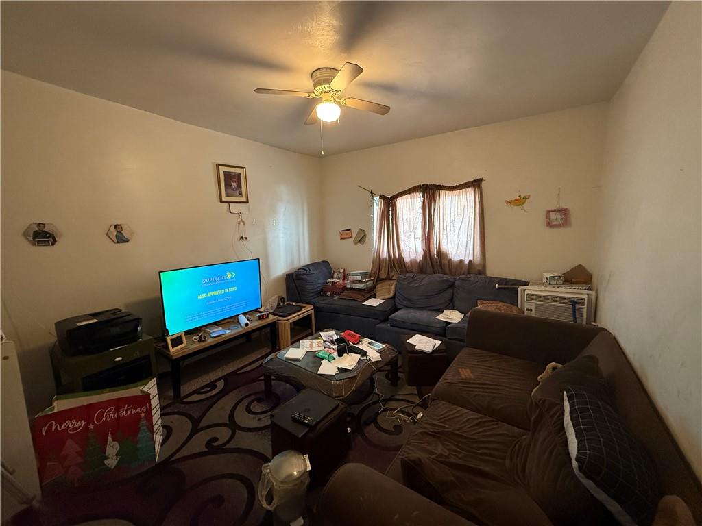 1205 Penn Street Pittsburgh, PA 15215 - Photo 26 of 49 a living room with furniture and a mirror