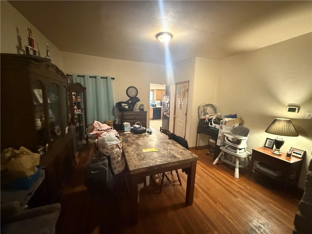 1205 Penn Street Pittsburgh, PA 15215 - Photo 37 of 49 a view of a dining room with furniture and wooden floor