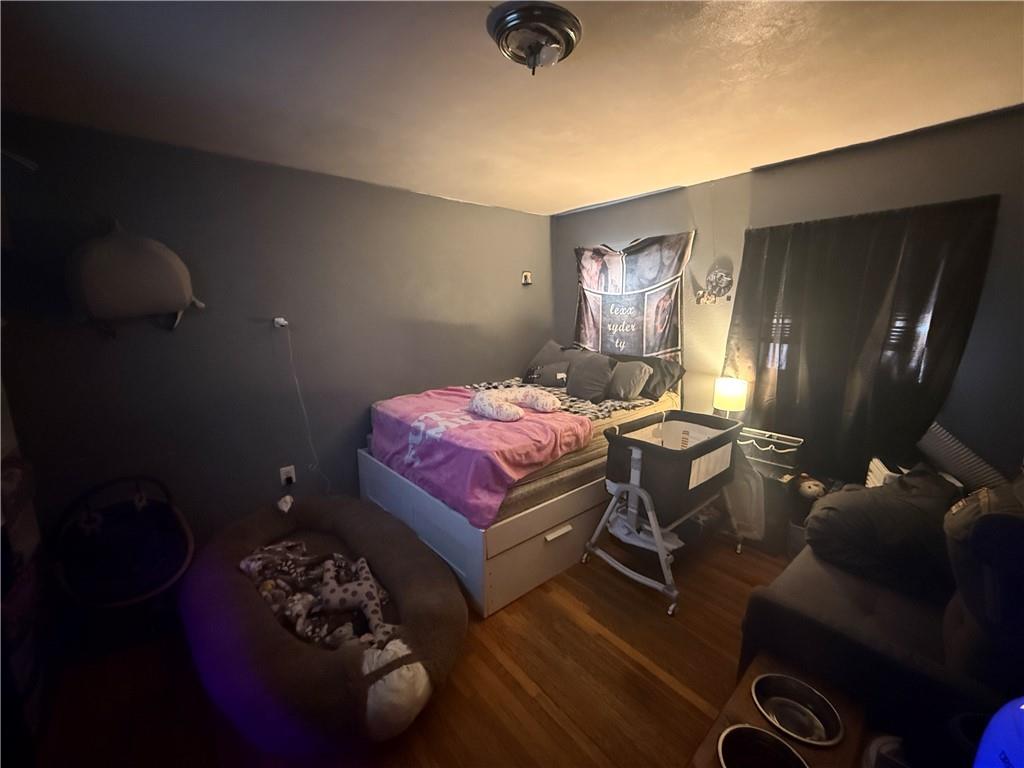 1205 Penn Street Pittsburgh, PA 15215 - Photo 46 of 49 a bedroom with a bed and furniture