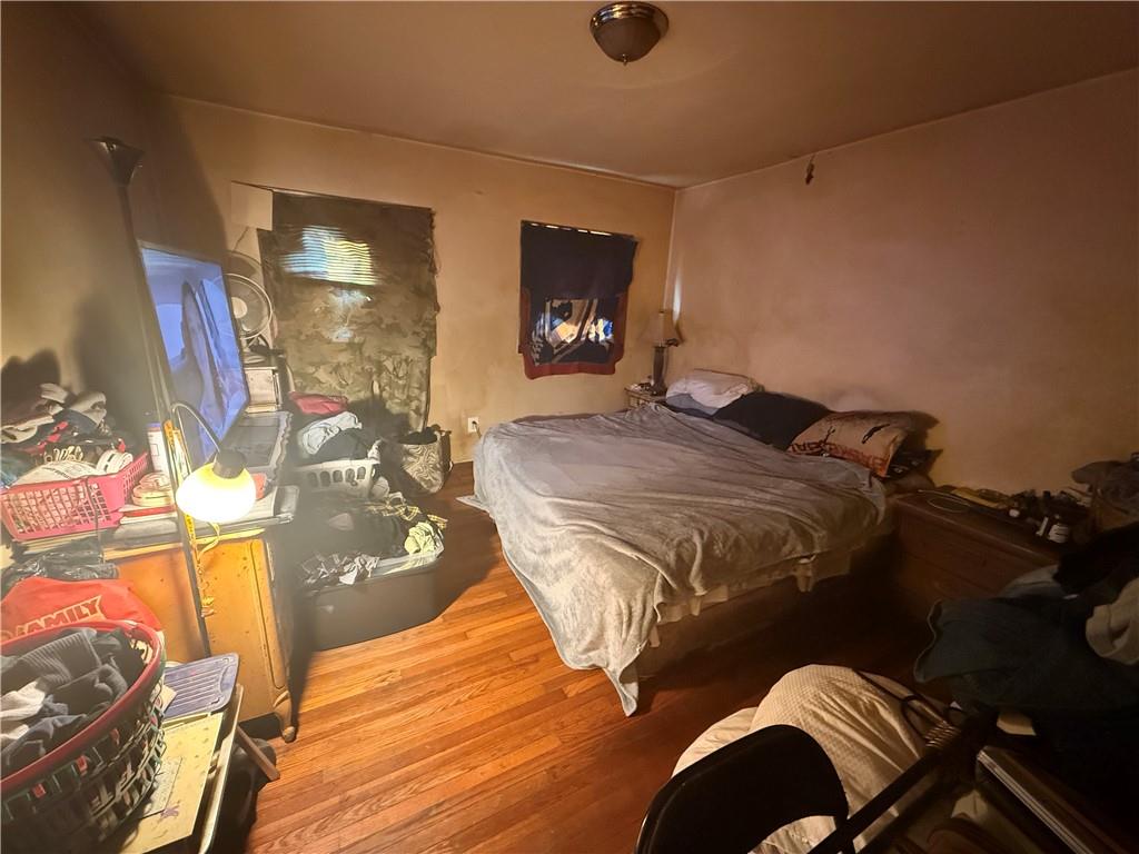 1205 Penn Street Pittsburgh, PA 15215 - Photo 47 of 49 a bed sitting in a room next to a window