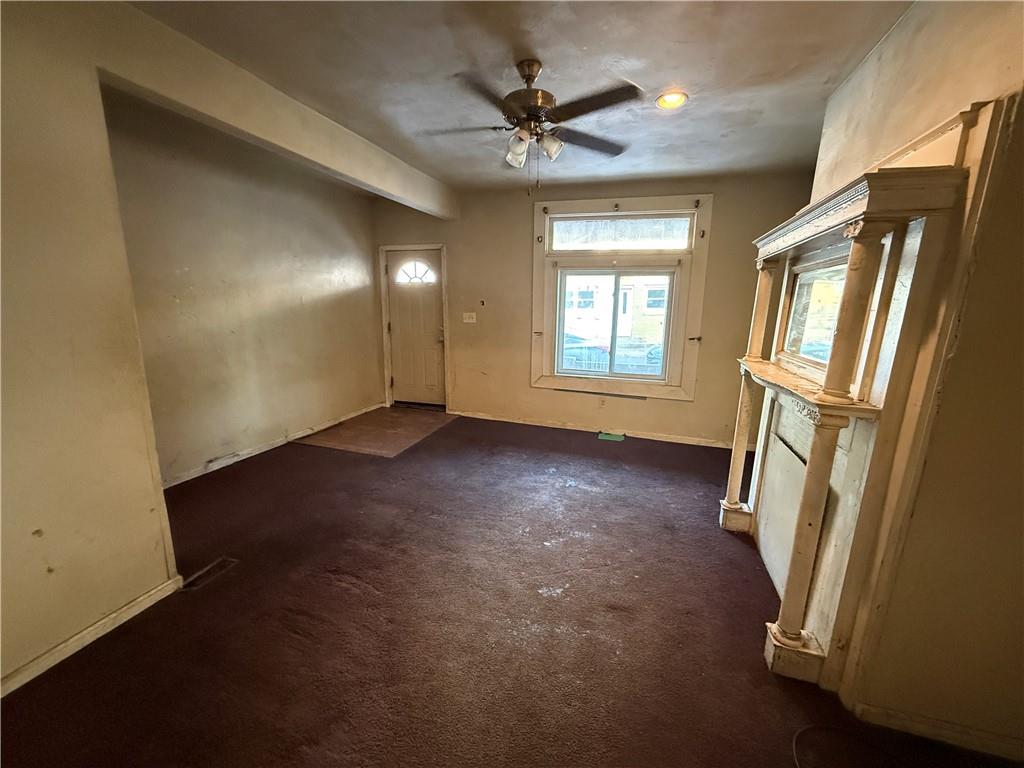 1205 Penn Street Pittsburgh, PA 15215 - Photo 6 of 49 an empty room with windows and fan