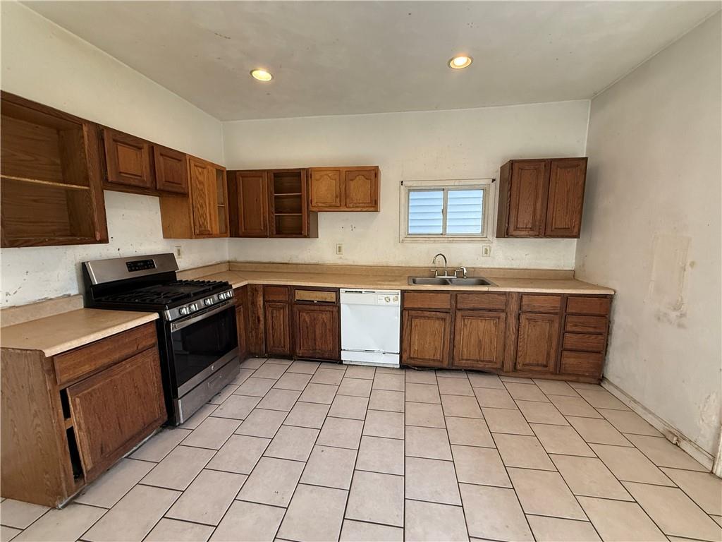 1205 Penn Street Pittsburgh, PA 15215 - Photo 8 of 49 a kitchen with a stove sink and cabinets