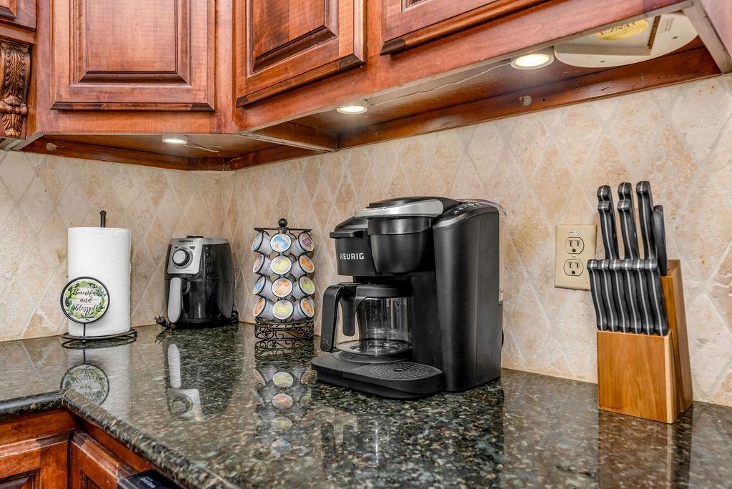 3330 Timberview Road Dallas, TX 75229 - Photo 20 of 39 Kitchen with tasteful backsplash and dark stone counters