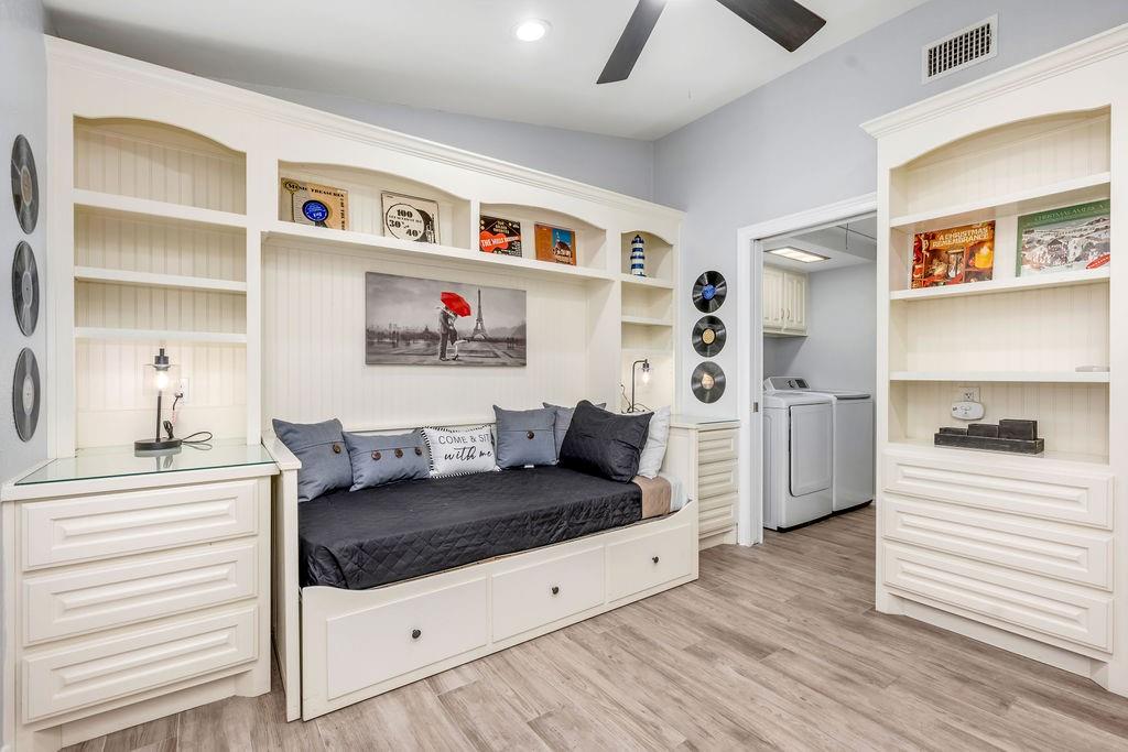 3330 Timberview Road Dallas, TX 75229 - Photo 26 of 39 Mudroom with independent washer and dryer, vaulted ceiling, light hardwood / wood-style flooring, and ceiling fan
