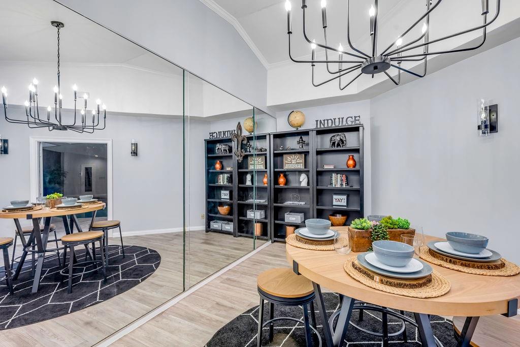 3330 Timberview Road Dallas, TX 75229 - Photo 29 of 39 Dining area with lofted ceiling, wood-type flooring, and crown molding
