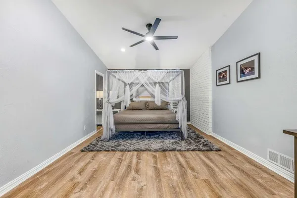 a living room with a couch and a rug