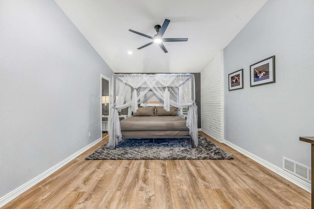 3330 Timberview Road Dallas, TX 75229 - Photo 34 of 39 Sitting room with ceiling fan, lofted ceiling, and hardwood / wood-style flooring