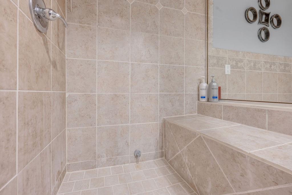 3330 Timberview Road Dallas, TX 75229 - Photo 36 of 39 Bathroom with tiled shower