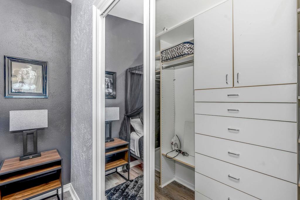 3330 Timberview Road Dallas, TX 75229 - Photo 38 of 39 Spacious closet with hardwood / wood-style floors