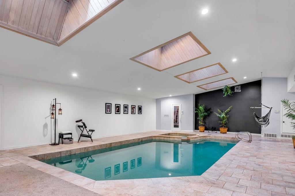 3330 Timberview Road Dallas, TX 75229 - Photo 8 of 39 View of swimming pool with a skylight