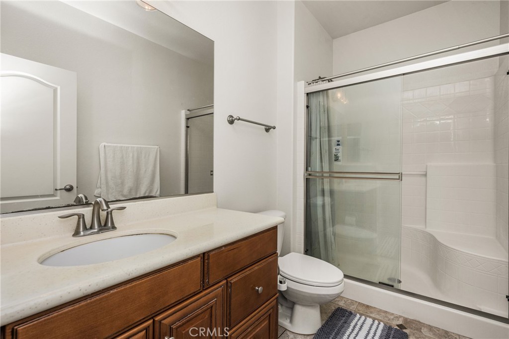 12652 Twin Peak Court Riverside, CA 92503 - Photo 38 of 55 a bathroom with a sink toilet and shower