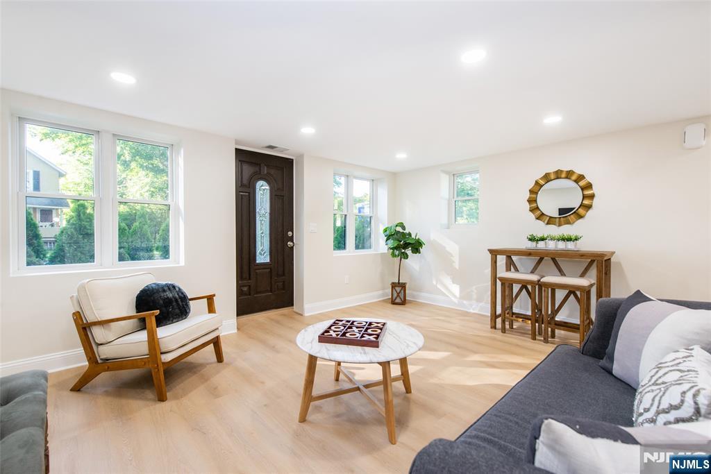 145 Grove Street Mahwah, NJ 07430 - Photo 21 of 30 a living room with furniture and a potted plant