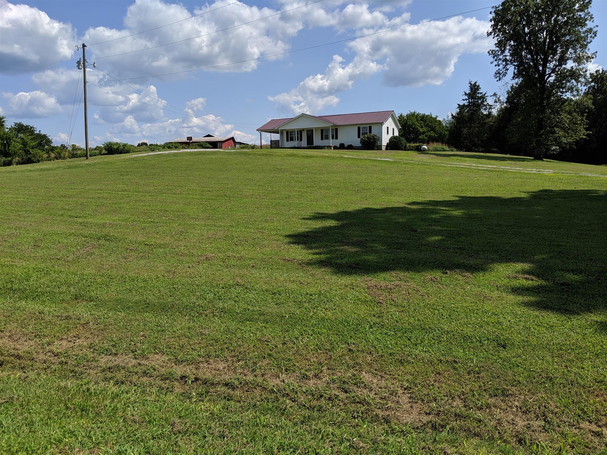 3319 Penile Hill Road Decherd, TN 37324 - Photo 5 of 21 a view of a big yard with a house