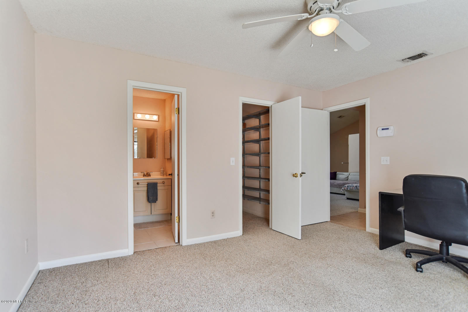 8333 Gemini Road Jacksonville, FL 32216 - Photo 11 of 25 Guest Bedroom Bath and closet view