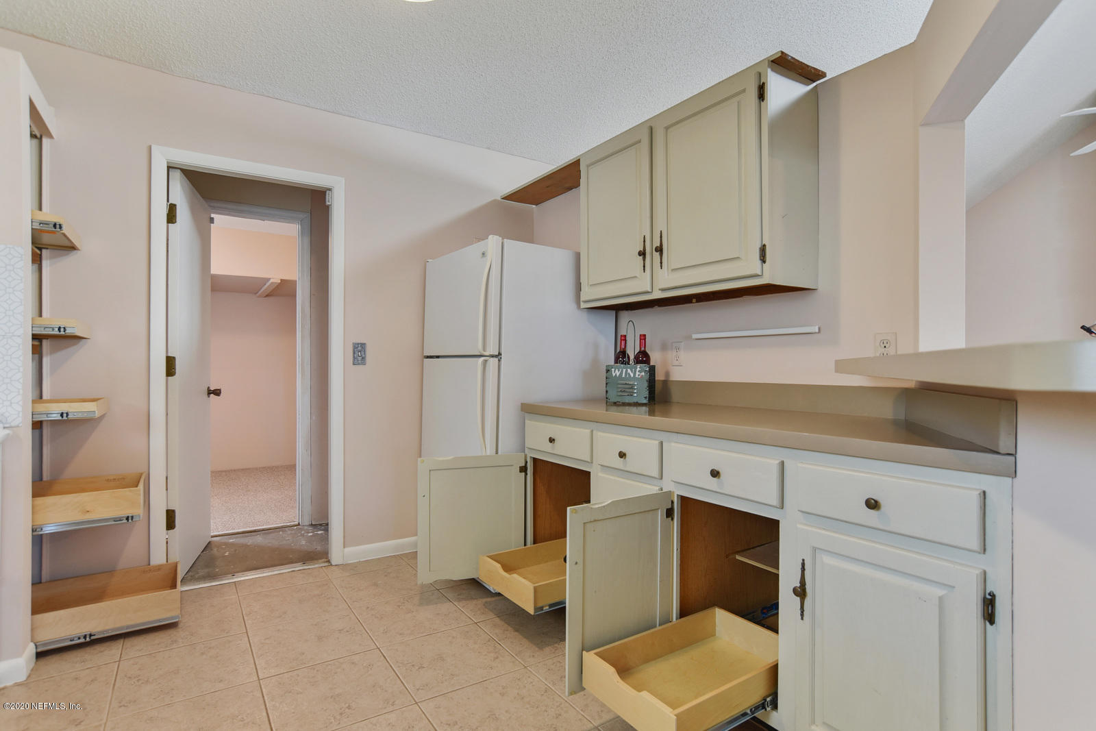 8333 Gemini Road Jacksonville, FL 32216 - Photo 23 of 25 Kitchen Babinets and storage